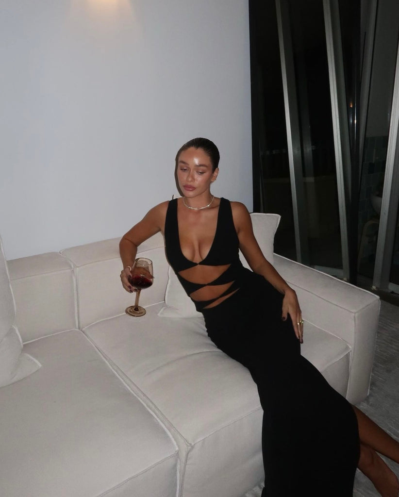 The 'Elise Gown' crafted from figure-hugging stretch crepe, featuring edgy diamond-shaped cutouts at the front."